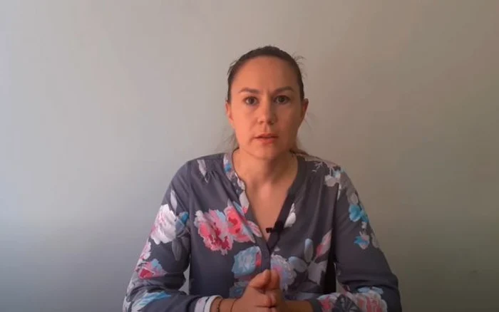 În imagine Maria Moroz, cerând cetăţenilor să iasă la grevă.