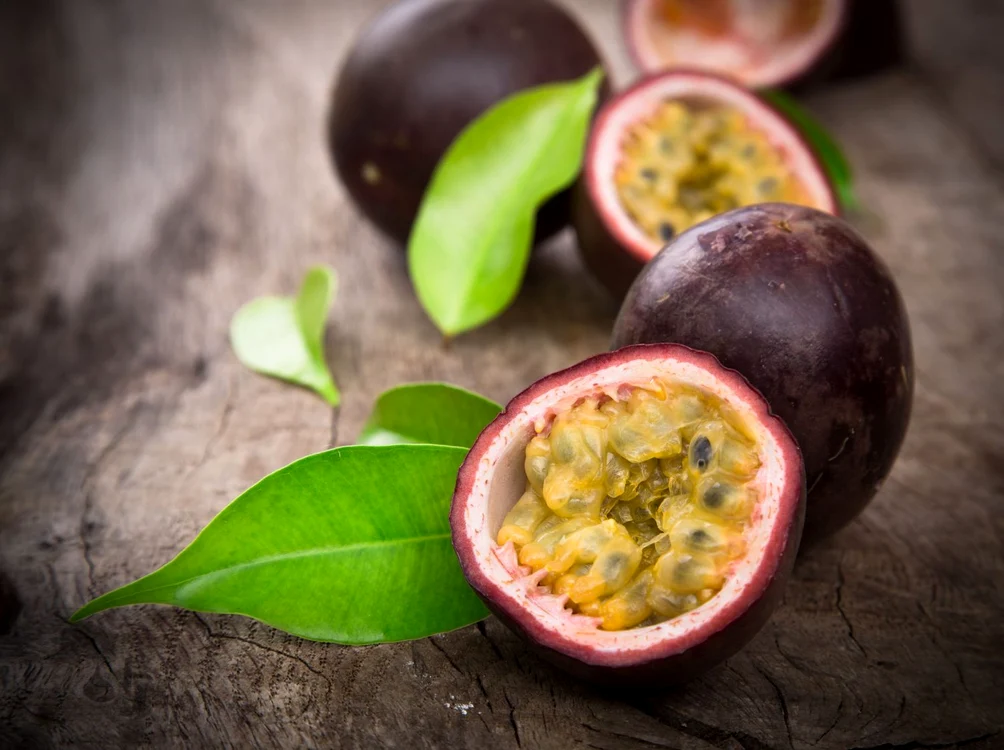 21048133   passion fruits on wooden background jpeg