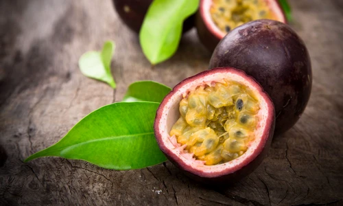 21048133   passion fruits on wooden background jpeg