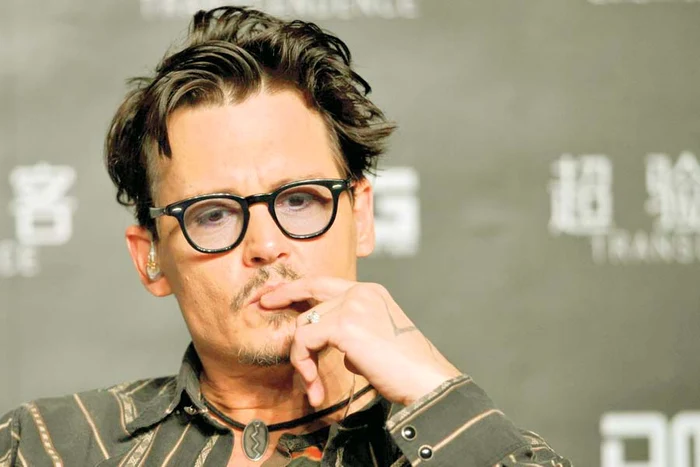 
    Starul a recunoscut  că poartă inelul  de logodnă (Fotografii: Reuters)  