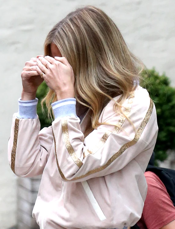 Gwyneth Paltrow covers her face while leaving her home in New York City jpeg