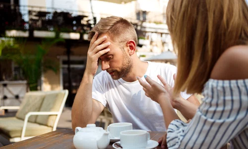 young beautiful couple quarreling sitting cafe jpg