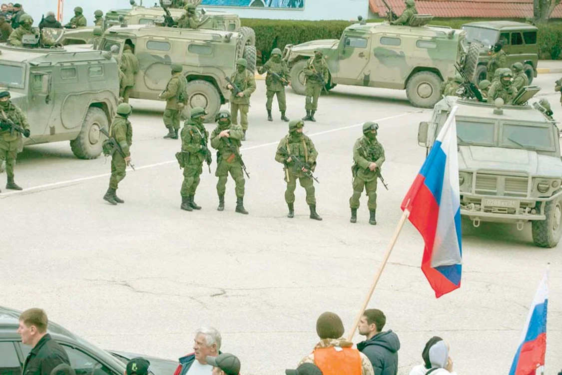 Principalele căi de  acces din zonă, păzite  de trupe de comando (Fotografii: reuters / grafic news)