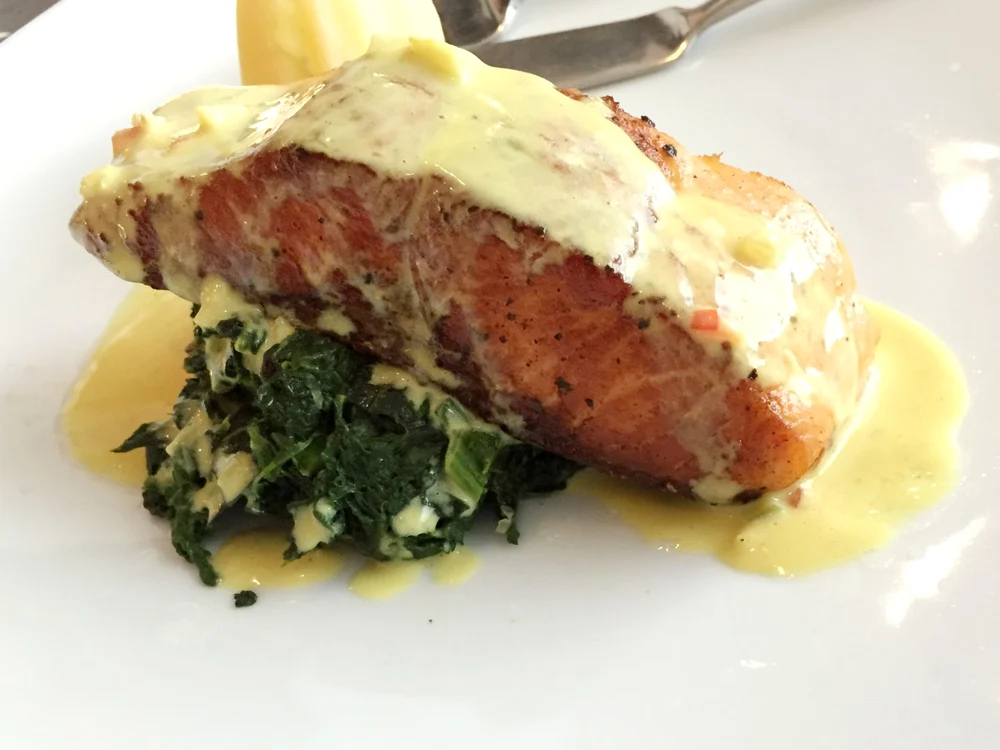 Salmon on spinach, topped with a cream sauce jpeg
