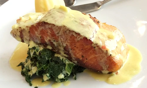 Salmon on spinach, topped with a cream sauce jpeg
