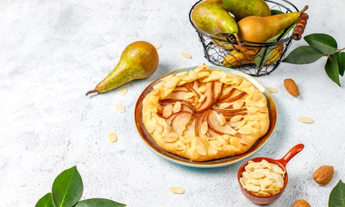 homemade pear galette pie with almond leaves fresh ripe green pears jpg