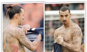 Dragonul şi cărţile de joc sunt deja celebre  Pe braţul stâng sunt scrise numele tuturor membrilor familiei   jpeg