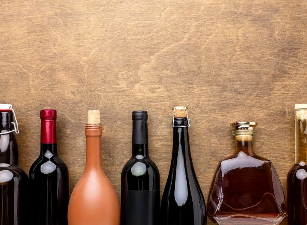 Șoferii care au sticle de alcool în mașină, testați cu etilotestul - Foto Arhivă