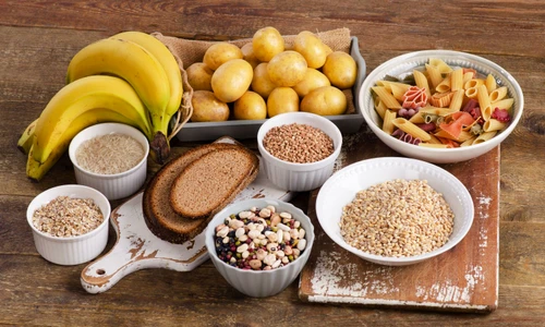 53650552   foods high in carbohydrate on wooden background  top view jpeg