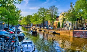 7782435 barche sul fiume amstel ad amsterdam olanda paesi bassi hdr foto jpg