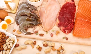 assortment raw protein sources including meat seafood eggs nuts jpg