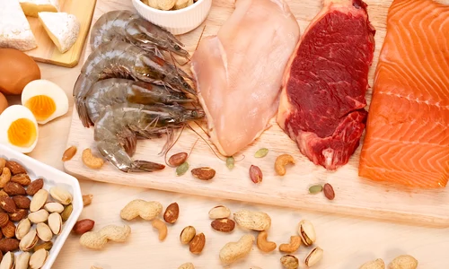 assortment raw protein sources including meat seafood eggs nuts jpg