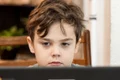 copil scoala online elev laptop unsplash jpeg