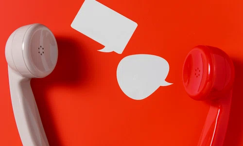 flat lay chat bubbles with two telephone receivers jpg