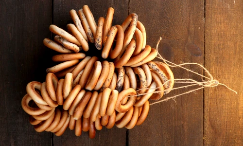 16063054   tasty bagels on rope, on wooden background jpeg