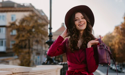 beautiful stylish woman purple suit walking city street spring summer autumn season fashion trend wearing hat holding purse jpg