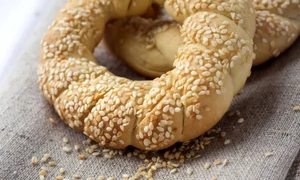 Two homemade bagels with sesame on a gray canvas jpeg