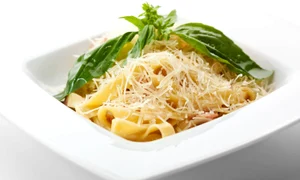 15172841   traditional fettucine alla carbonara with basil leaf jpeg