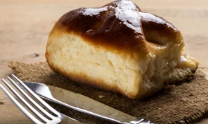 53447206   fresh romanian cheese pie with fork and knife jpeg