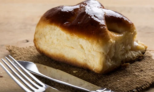 53447206   fresh romanian cheese pie with fork and knife jpeg