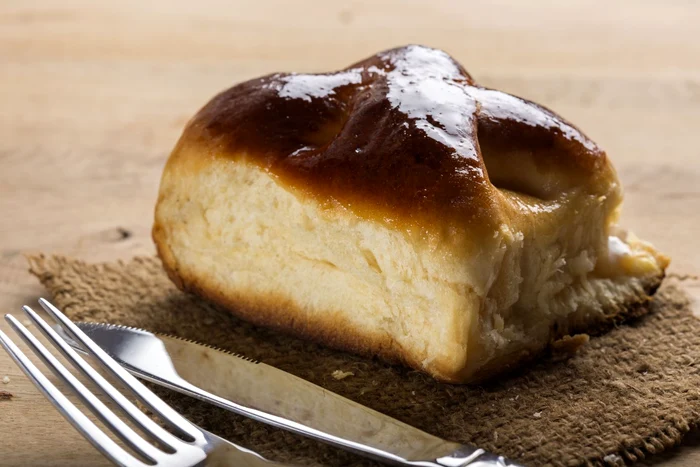 53447206   fresh romanian cheese pie with fork and knife jpeg
