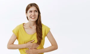 girl feeling sick touching stomach complaining cramps pain jpeg