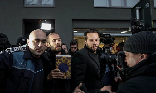 Fratii Tate escortati de politisti la iesirea din sediul DIICOT 26 ianuarie FOTO Inquam Photos Sabin Cirstoveanu