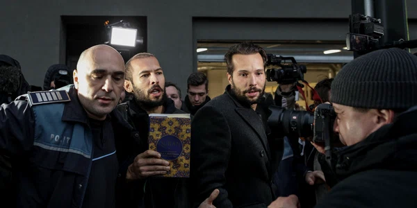 Fratii Tate escortati de politisti la iesirea din sediul DIICOT 26 ianuarie FOTO Inquam Photos Sabin Cirstoveanu 