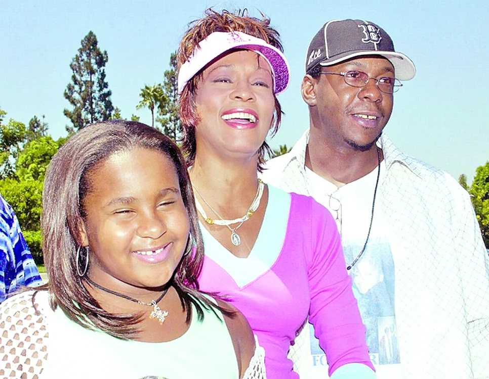 Pe vremea când erau fericiţi, împreună cu fiica lor, Bobbi Kristina
