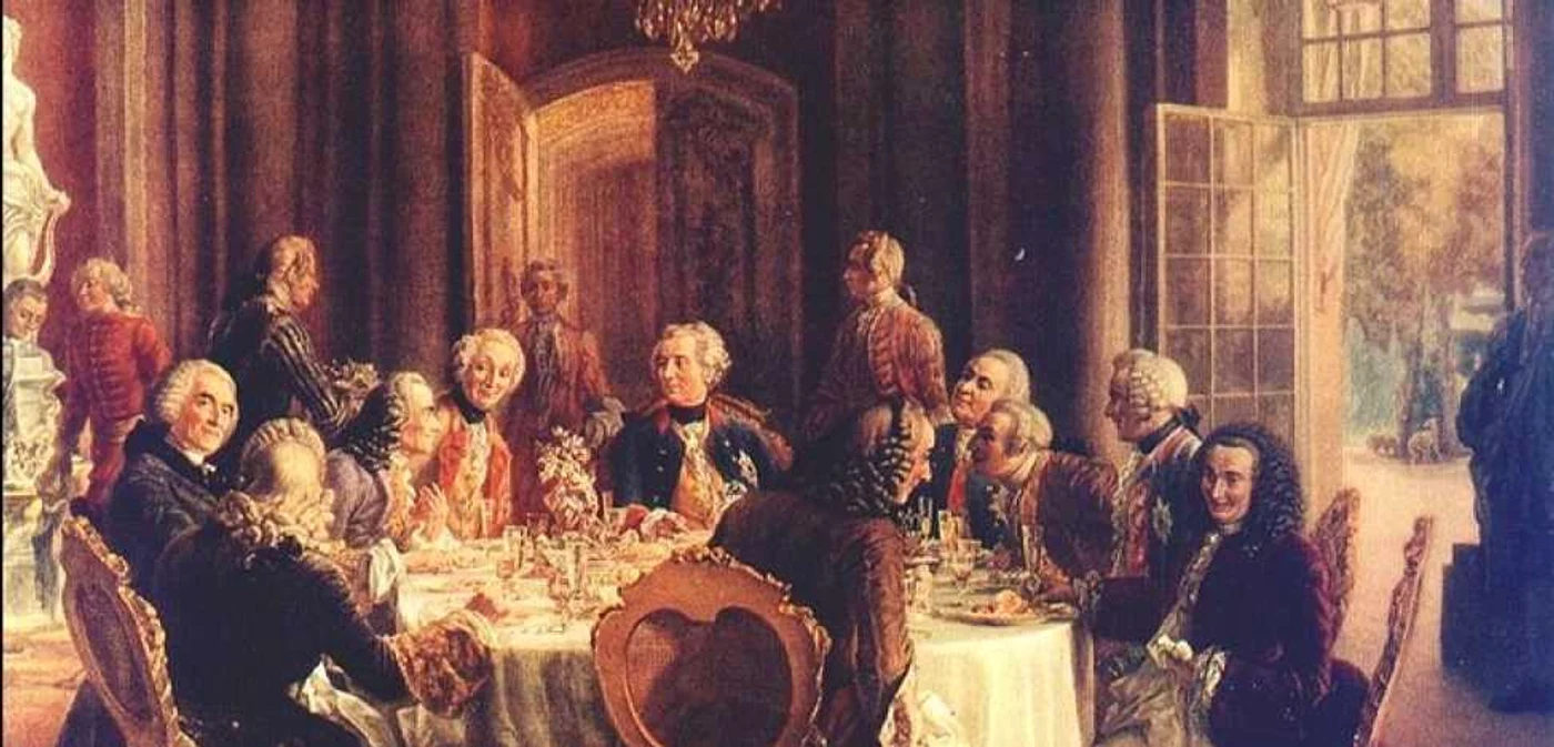 Adolph Menzel: La masa rotundă regele Friedrich II/Frederic cel Mare (în centru), la Sanssouci, cu Voltaire (stânga} şi personalităţi din Academia de Ştiinţă, din Brandenburg şi Academia din Berlin; pictură din anul 1850, aflată la Galeria Naţională din Berlin. Deviza sa era:"Eu sunt primul supus statului meu."