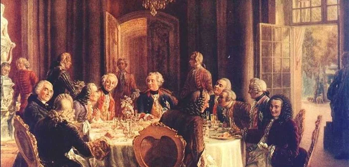 Adolph Menzel: La masa rotundă regele Friedrich II/Frederic cel Mare (în centru), la Sanssouci, cu Voltaire (stânga} şi personalităţi din Academia de Ştiinţă, din Brandenburg şi Academia din Berlin; pictură din anul 1850, aflată la Galeria Naţională din Berlin. Deviza sa era:"Eu sunt primul supus statului meu."