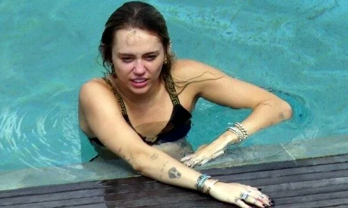miley cyrus and kaitlynn carter kissing by pool in lake como jpeg
