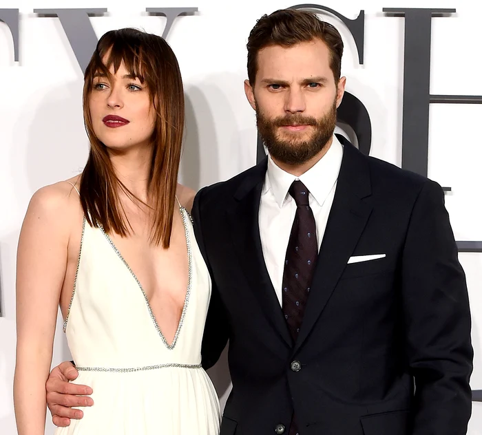 
    Dakota Johnson și Jamie Dornan, starurile din controversatul film "Fifty Shades of Grey"Foto: Getty  