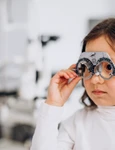 little girl checking up her sight ophthalmology center jpg