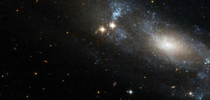 Galaxia spirală ESO 499-G37 FOTO ESA/NASA/Hubble