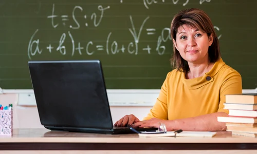 female teacher with laptop working jpg