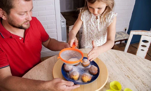 girl completing homemade cupcakes jpg