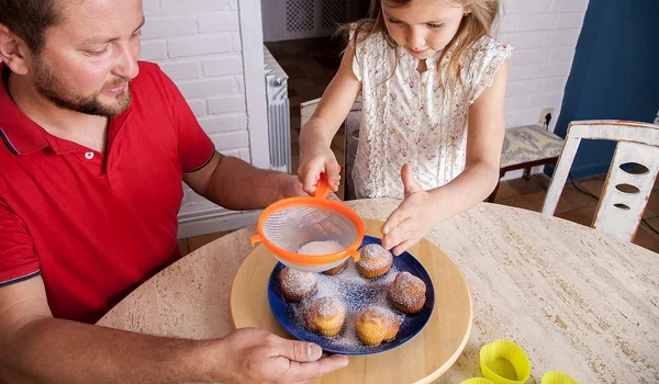 girl completing homemade cupcakes jpg