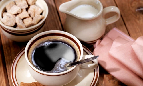 10615653   coffee milk and sugar on wooden table jpeg