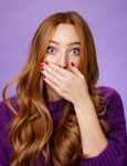 impressed speechless cute ginger girl hearing stunning gossip covering mouth form amazement shoo jpg