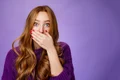 impressed speechless cute ginger girl hearing stunning gossip covering mouth form amazement shoo jpg