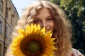 front view woman posing with sunflower jpg