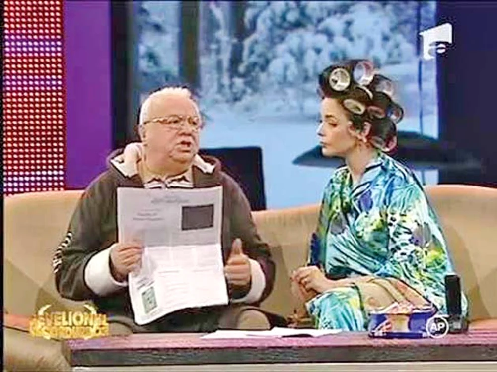 A ajuns la  televiziune cu  bigudiurile în păr 