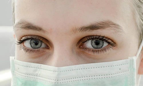 1 closeup photo of woman s eye wearing mask jpg jpeg