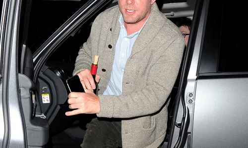 Guy Ritchie arriving at Madonnas home, just after 9pm, with a corked bottle of wine  Guy left only 20 minutes later jpeg