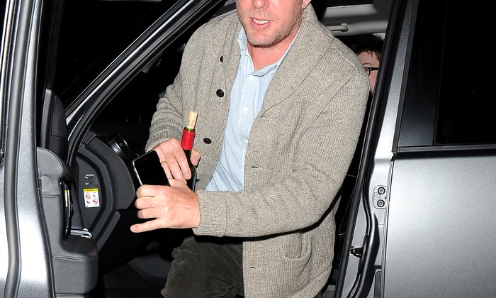 Guy Ritchie arriving at Madonnas home, just after 9pm, with a corked bottle of wine Guy left only 20 minutes later jpeg