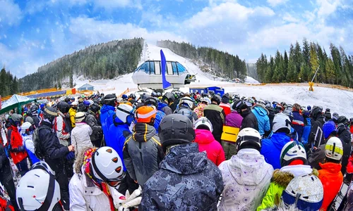 people stand before ski lift getty jpg