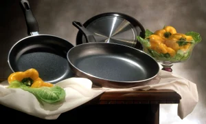 6786663 set of frying pans with pepper decoration jpeg