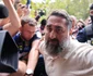 Ionel Rusen este escortat de polițiști la sediul DIICOT din București, 21 septembrie 2026. Inquam Photos / George Călin