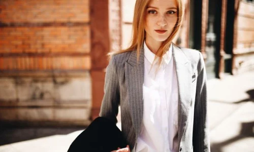 blonde lady in grey suit enjoys the sunshine on the bright street of new york city 8353 1586 jpeg